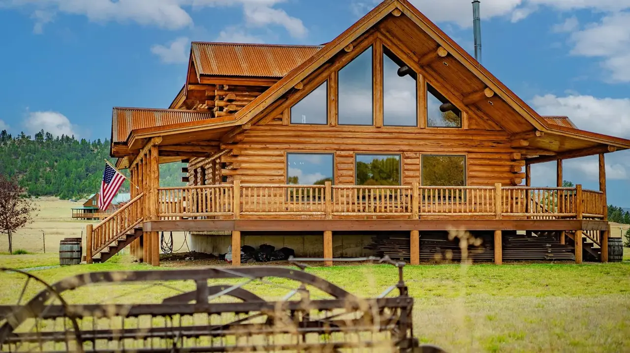 Wild Horse exterior with gable windows and deck, Meadowlark Log Homes