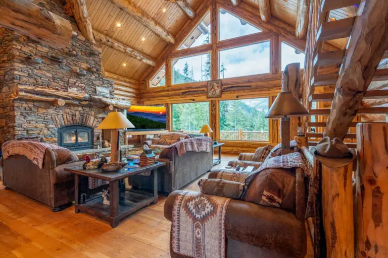 Cozy rustic cabin interior with wooden beams and stone fireplace